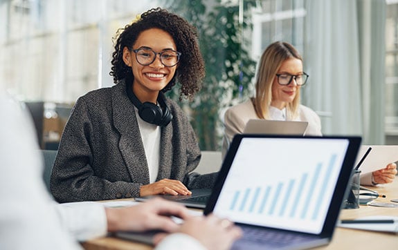 Two female finance workers working in an office